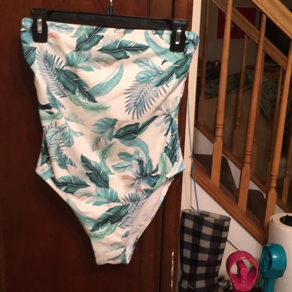 White and green floral one piece.